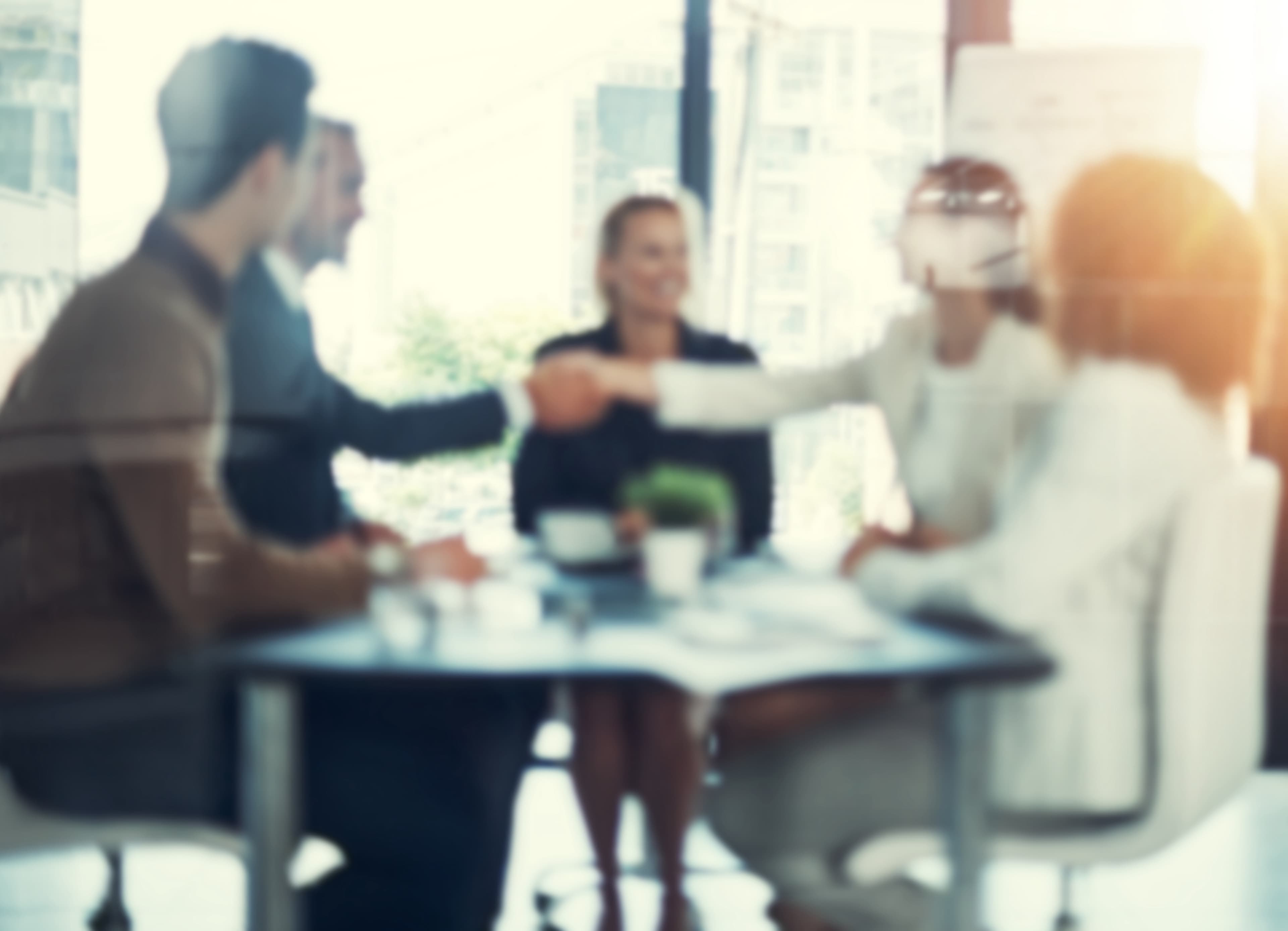 Cropped shot of businesspeople shaking hands during a meeting in an office